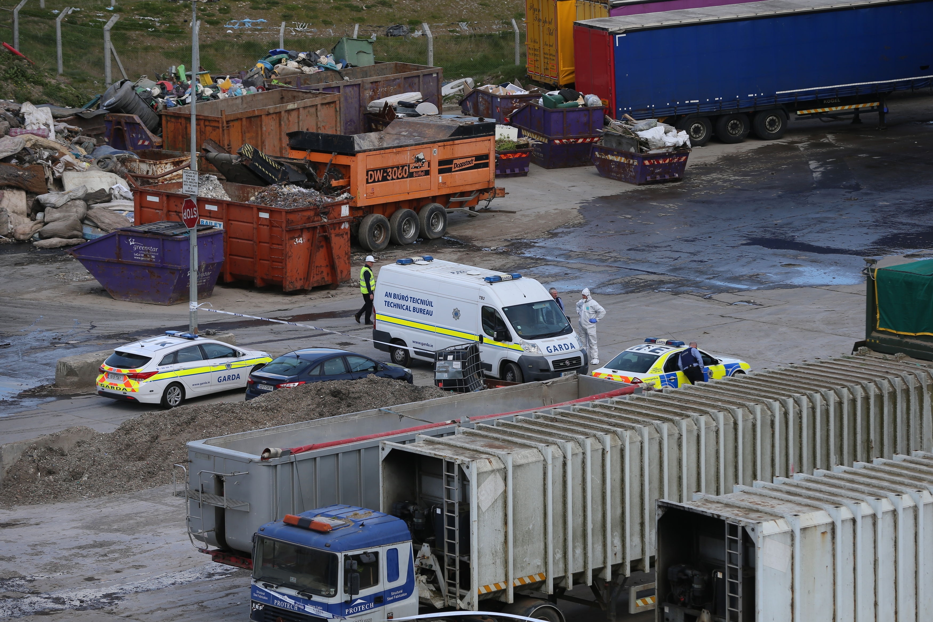 Forensic officers at the recycling facility in Bray, County Wicklow, Ireland, where suspected remains of a newborn baby have been discovered.