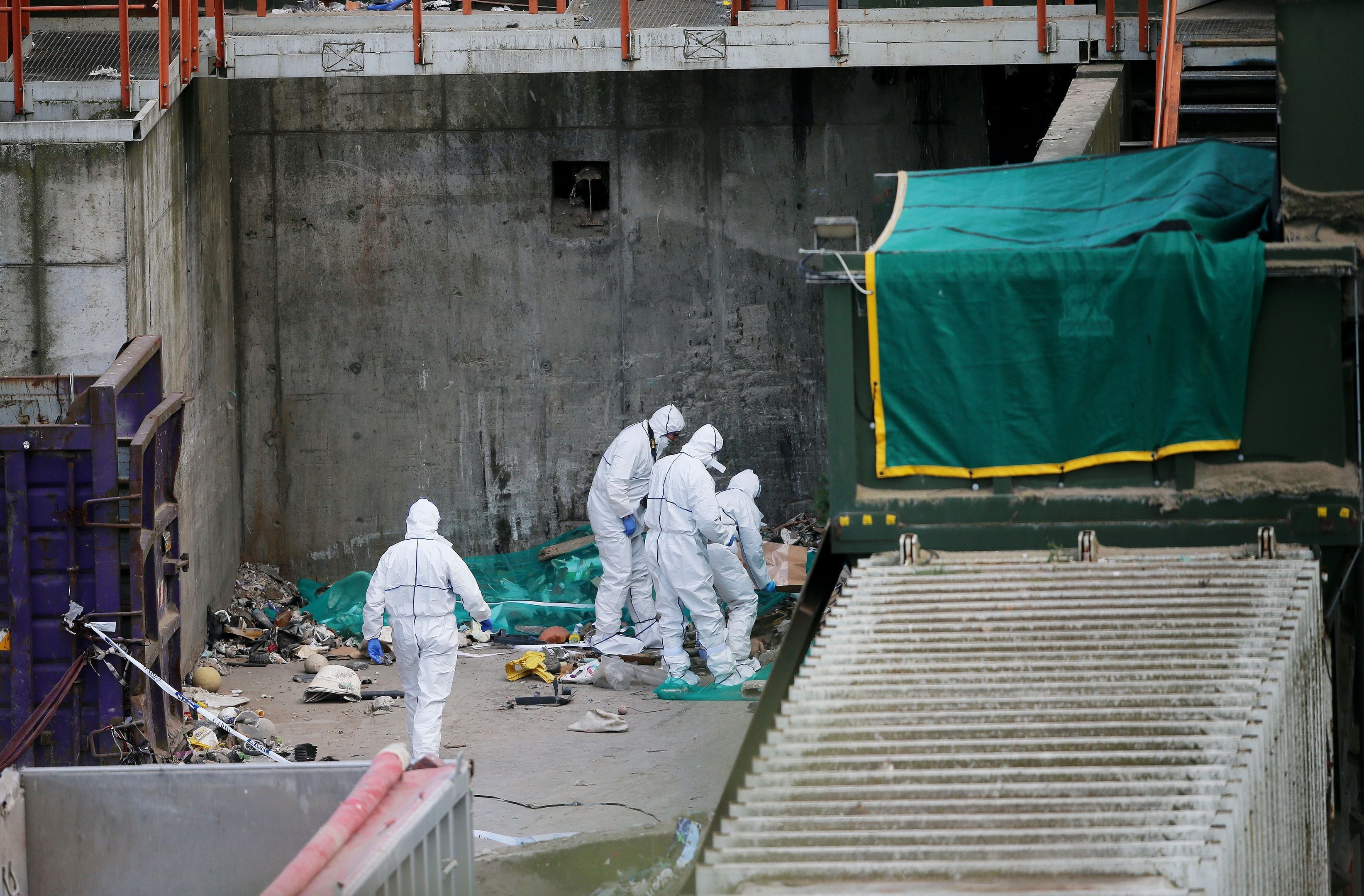 Forensic officers at the recycling facility in Bray, County Wicklow, Ireland, where suspected remains of a newborn baby have been discovered.