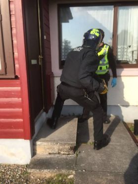 Police during a series of drugs raids in Ross-shire