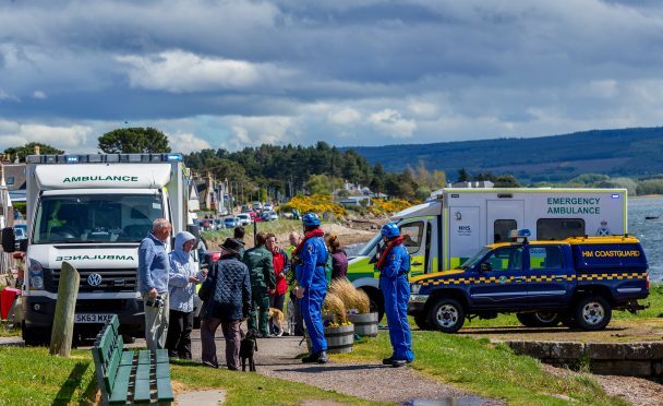 Emergency services on the scene in Findhorn Bay. [Picture - Brian Smith]