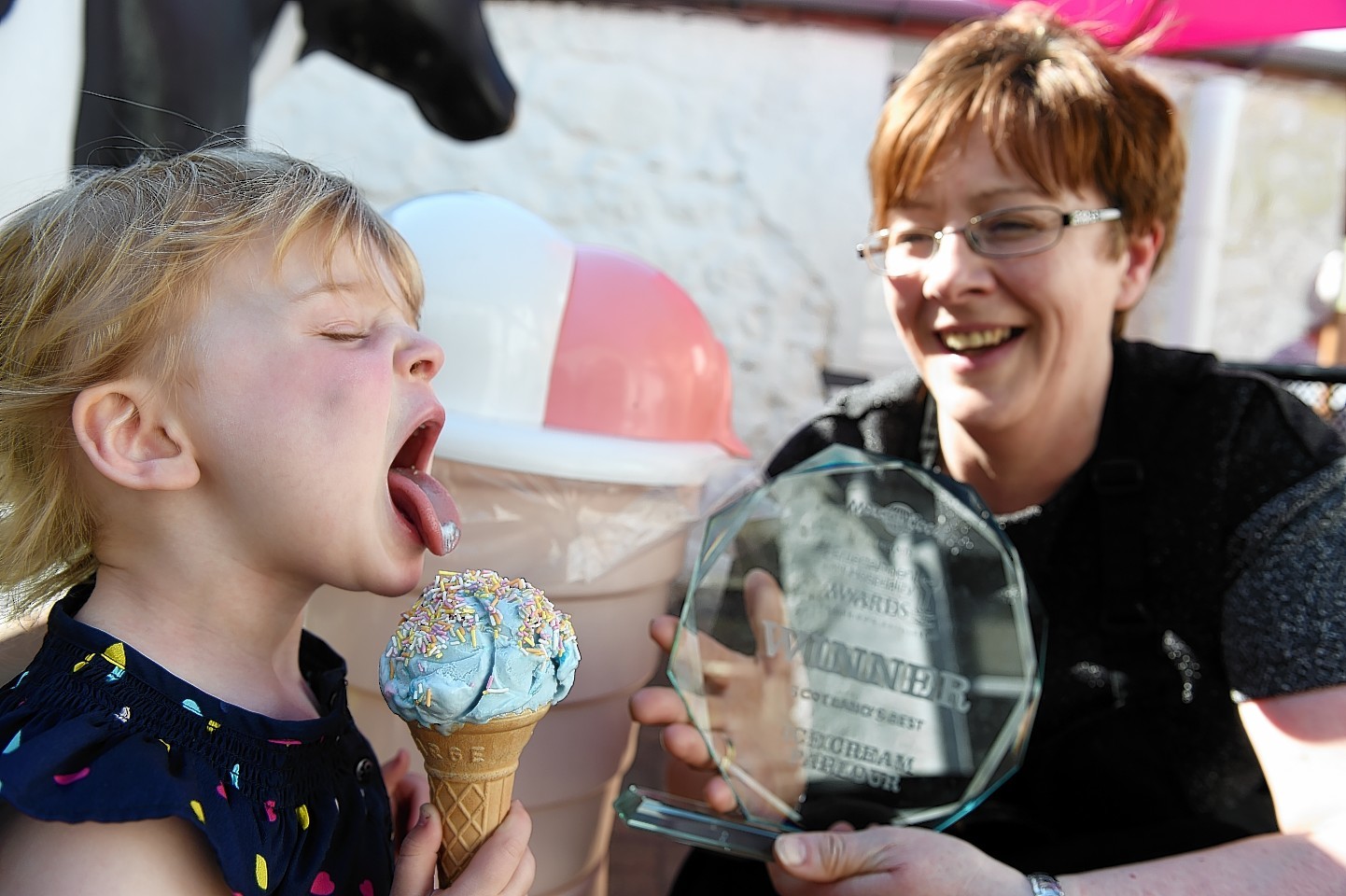 Ailsa Gilchrist enjoys her cone with Sheila Gray, right, at Fochabers Ice Cream Parlour.
Picture by Gordon Lennox