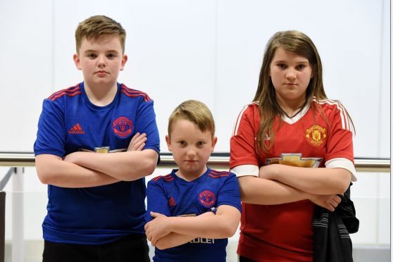 Connor Lawless, 14,  Mya Cruickshank, 11, and younger brother Alfie, 7, were left disappointed after had made their first trip to Old Trafford. Picture by Kenny Elrick