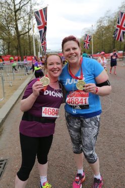 Dionne Winter and Julie Ann Marshall bask in the glory of finishing their first marathon