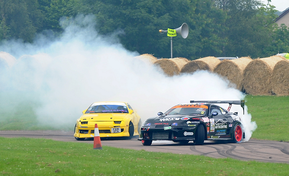 Cars drifting around the track at last years SpeedFest