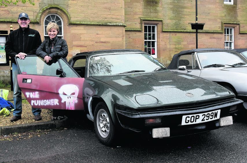 Andrew and Elaine Walls with "The Punisher" a 1980 Triumph TR7.