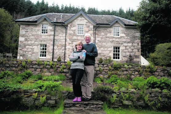 David Anderson  with his wife Bridget and Roly the dog at, Dalvrecht Manse Tomintoul Ballindalloch Moray.