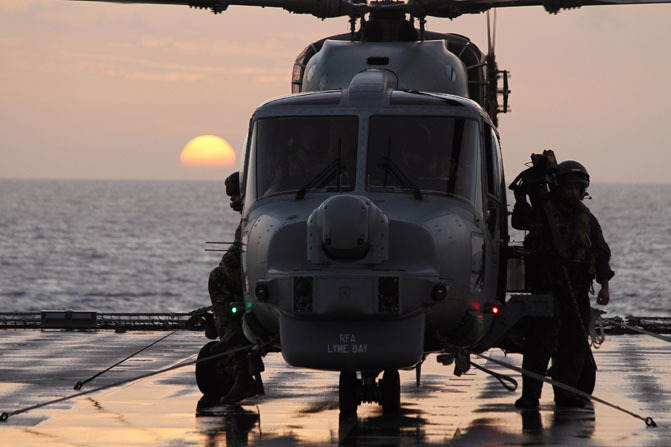The RN Amateur Photographer of the Year Award Commended.  Awarded to the best portfolio of 3 Service-related photographs submitted by an individual from a variety of subjects.Sponsor: Lockheed Martin.A Royal Navy Lynx helicopter provides over watch to the boarding team from RFA Lyme Bay during a counter narcotics patrol in the Caribbean.