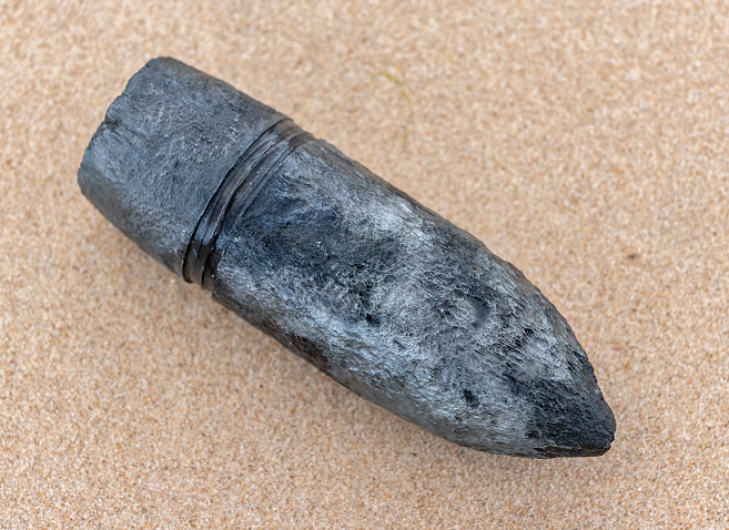 One of the war head shells (3 were found).