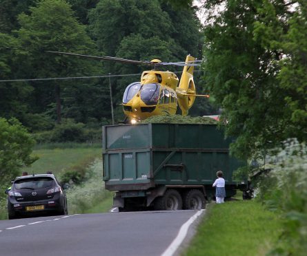 The air ambulance arrives at the scene of the crash