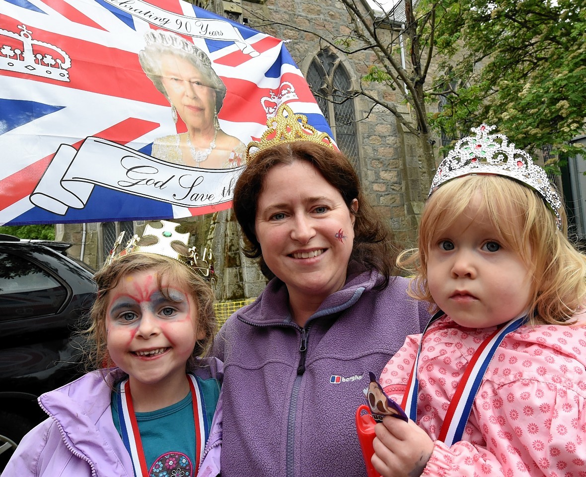  In the picture are from left: Elizabeth Hay, 6, Catherine Hay and Eleanor Hay, 2, with a flag of the Queen. Picture by Jim Irvine 