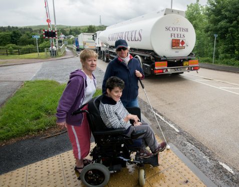 Jan MacLugash (left) with her daughter Tina and friend Annette Hobson attempting to cross the A830 near Banavie swing bridge