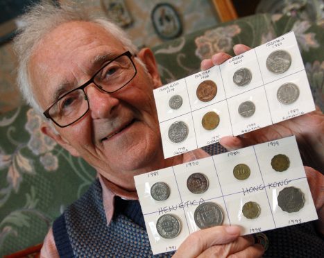 Billy Denney with some of his coin cards