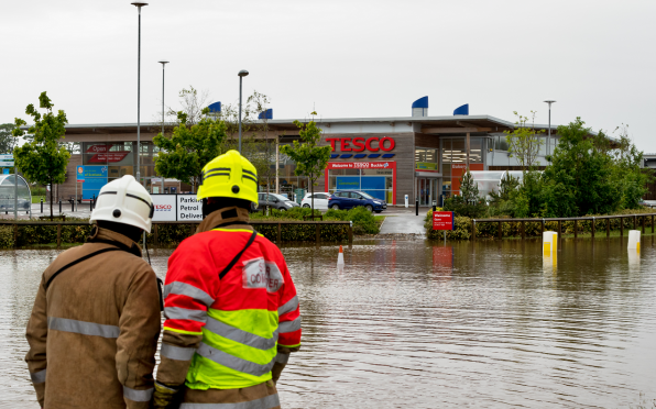 Tesco in Buckie closed its petrol station and operated with a skeleton staff after its car park was flooded.