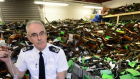 Chief constable Phil Gormley with surrendered weapons. SWNS