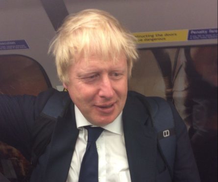 Boris Johnson on the Tube after voting