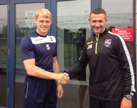 New Ross County signing Jay McEveley with Staggies manager Jim McIntyre.