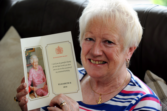 Adeline Reid, chairwoman of the Keith Cancer Link Support Group, with the thank you card she got from the Queen after sending her a 90th birthday card written in Doric. Picture by Gordon Lennox.