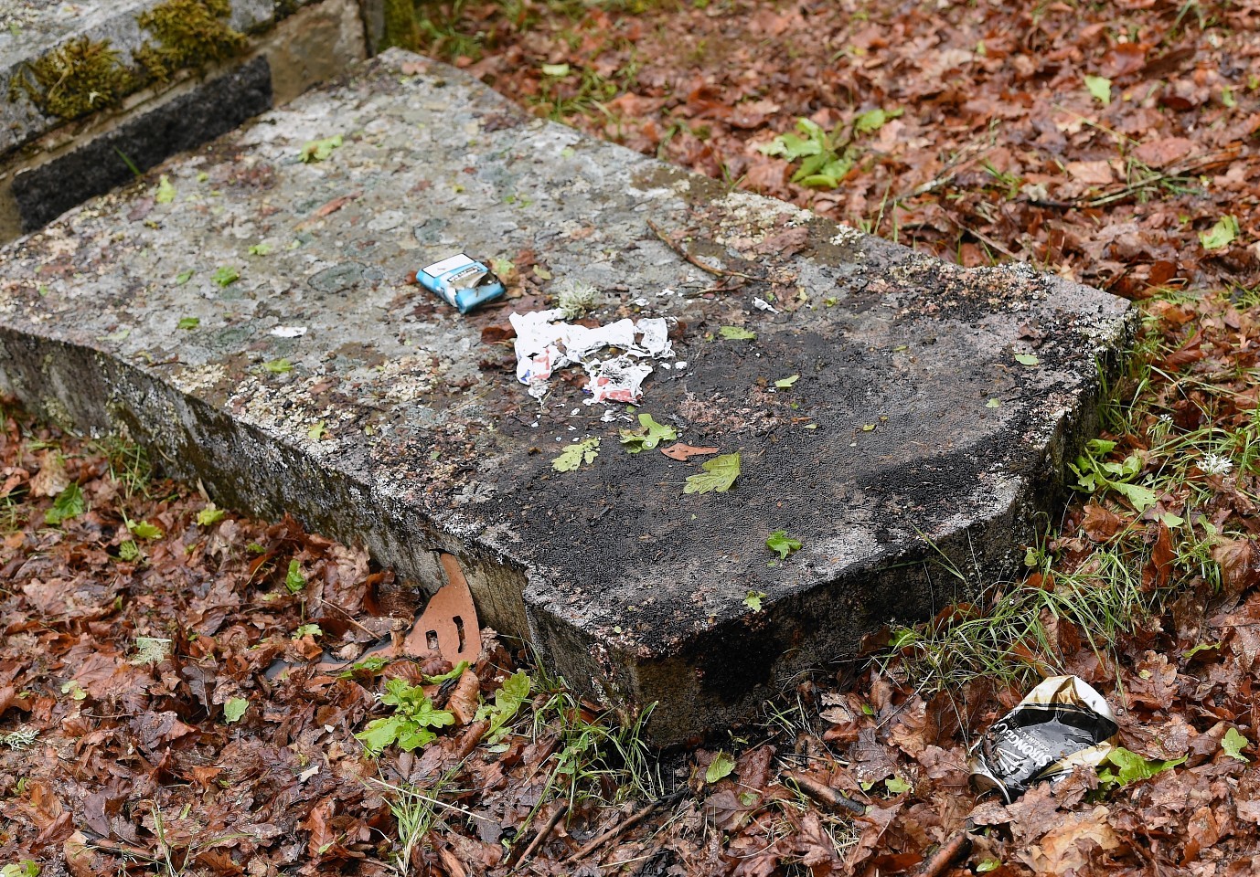 Dozens of damaged and broken grave stones in the Tomnahurich Cemetery