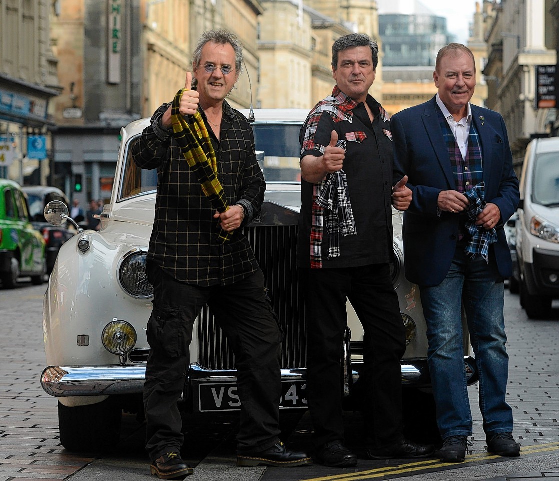 Stuart Wood (Woodie), Les McKeown, and Alan Longmuir, three members of the Bay City Rollers,