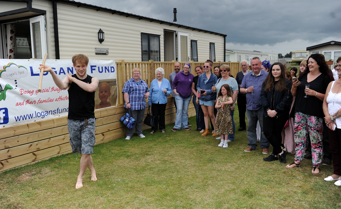 Logan's Sunny Days caravan was officially opened to its first guests on Sunday. Luke Cockram, from Rock Academy, Lossiemouth, entertains with dance.
Picture by Gordon Lennox