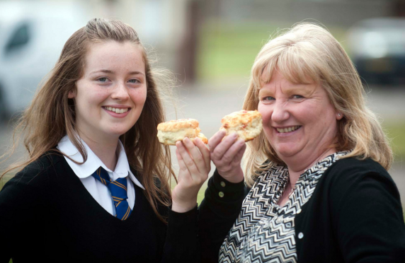 Grace Wakeford,13, is having her recipe for  scones used at Ashers Bakery in Lossiemouth with Margaret Davidson, from Ashers.
