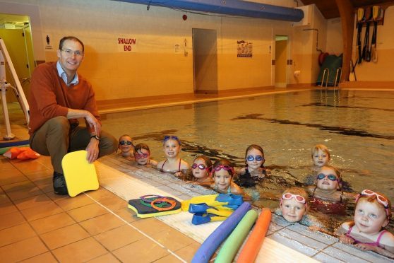 Pool manager Brian O’Rourke with children taking part in a swimming lesson at Mallaig swimming pool