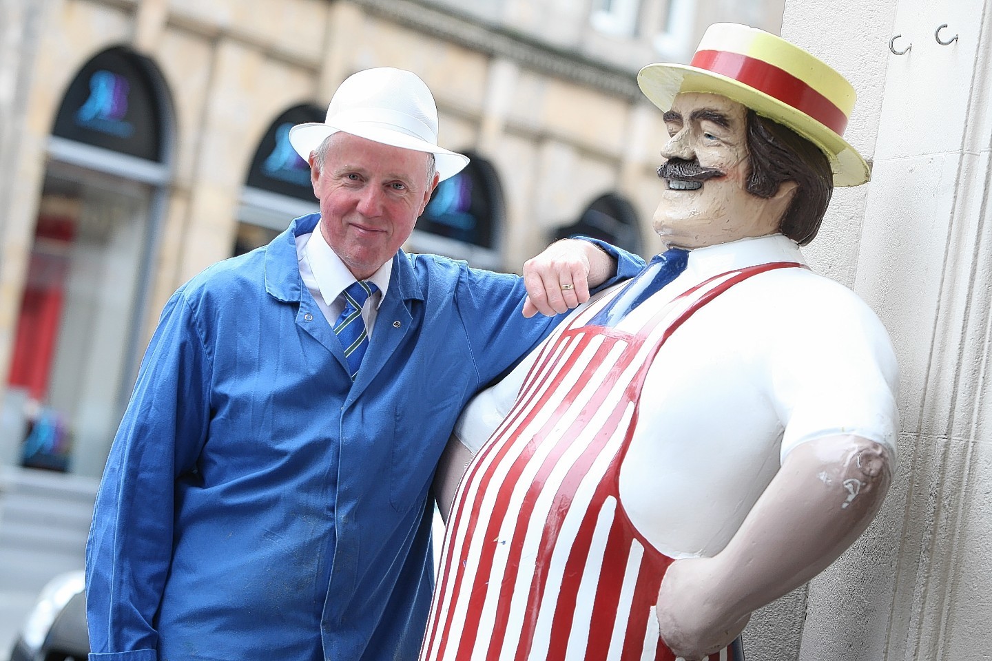 Duncan Fraser with the butcher's dummy that Highland Council told him to remove from outside his shop. Picture: Andrew Smith