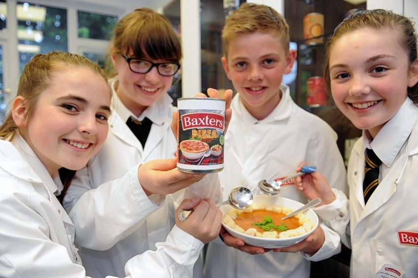 Four pupils from Milne's High School pose with a bowl of their winning pizza-flavoured soup. 