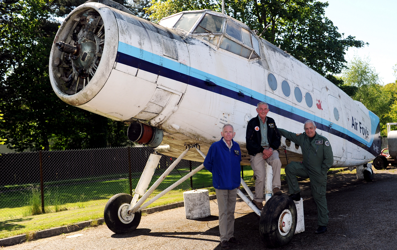 Bob Dunnett, director, Alistair Mackie, volunteer, and Bob Pountney, director, Morayvia Aerospace Centre, beside the fuselage of the Antonov AN-2, of which they recently took delivery.