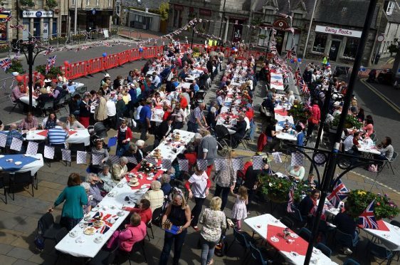 Oldmeldrum Village Square closed down for "massive" tea party to celebrate the Queen's 90th. Credit: Kenny Elrick.