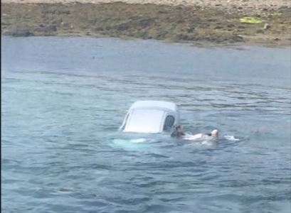 Stuart McIvor took to the water to save the driver. Pictures and video by Airpro Media