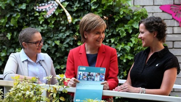 Nicola Sturgeon with cancer patients Laura Fitzsimmons, 29, left, and Susan Selkirk, 40, right, during a visit to the Macmillan Cancer Support centre at the Western General Hospital in Edinburgh