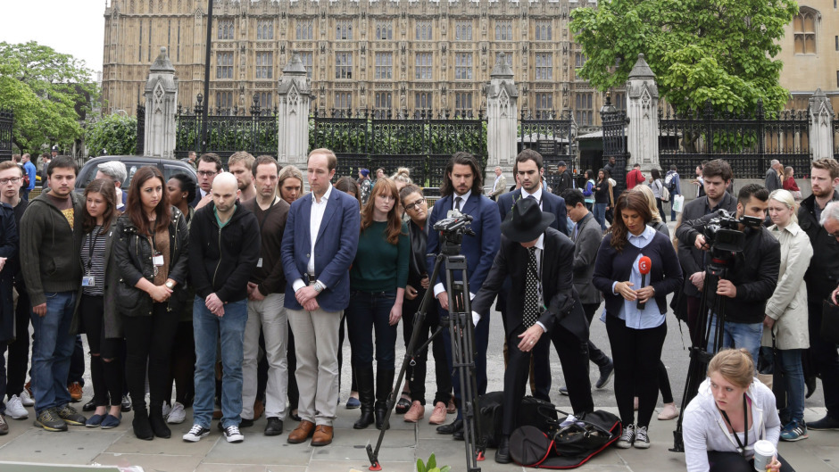 The public reflect on the life of Jo Cox at Parliament Square.