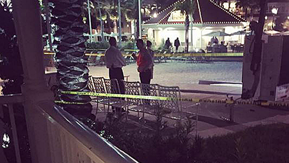 Picture taken with permission from the twitter feed of @KatherinePopp of the scene near Disney's Grand Floridian Resort in Orlando, after a two-year-old boy was dragged into the water by an alligator