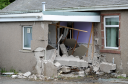 A man has died after the car that he was a passenger in crashed into a house on the A947 North of Turriff at Plaidy.