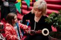 Scottish Chamber Orchestra bassoon player Alison Green shares instrument with youngster at fun day