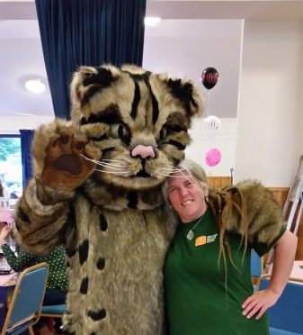 Scottish Wildcat Action (SWA) mascot, William the Wildcat, with Emma Rawling, SWA project officer.