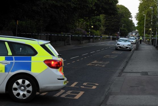 Police at the scene of the crash in Ellon