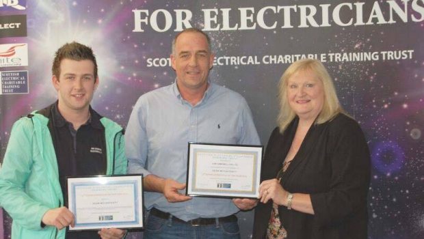 Sean (left) with his Apprentice of the Year  award, presented by Anne Galbraith, chief executive of SECTT, and Sean's employer Gavin Fraser from AM Campbell Ltd.