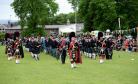 The massed pipe bands being led by Bert Summers,  Turriff drum major