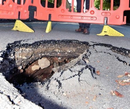 The large sink hole appeared at the bottom of Viewfield Raod