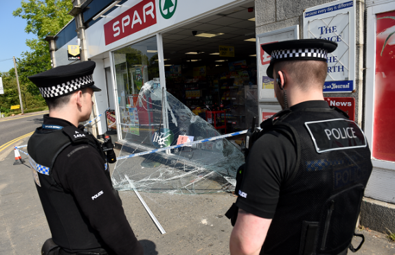 Police at the Spar shop yesterday morning