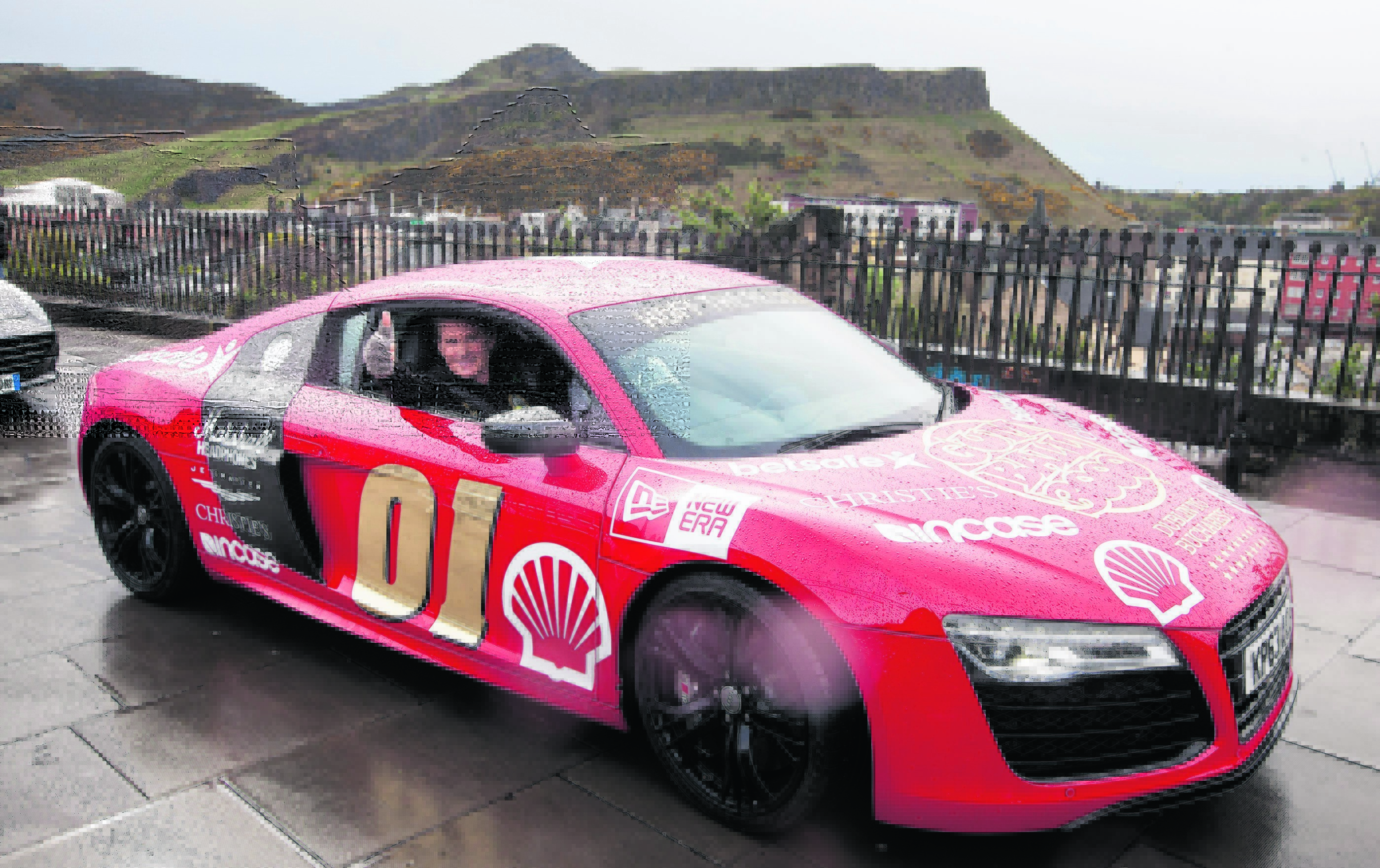 Actor David Hasselhoff in an Audi R6 joins the Gumball 3000 leaving Edinburgh on second leg of Dublin to Bucharest.