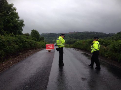 Police have shut the road five miles from the scene of the incident