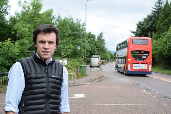 Councillor Ben Thompson at the road junction for Banavie Primary School