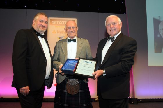 Dave Thompson is presented with a Status International Award from the Chartered Trading Standards Institute