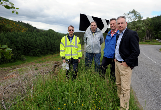 From left: Dave Malpas, senior engineer traffic for Moray Council, Cllr Mike McConnachie, George Tulloch, and MSP Richard Lochhead beside the steep drop alongside the B9014, Dufftown to Keith road. Gordon Lennox