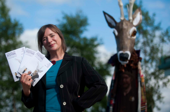 Findhorn Bay Festival director Kresanna Aigner at the launch of festival's programme with the events mascot, Struan the Stag.