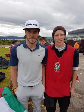 Gareth Bale with caddie Cameron Hook after the round