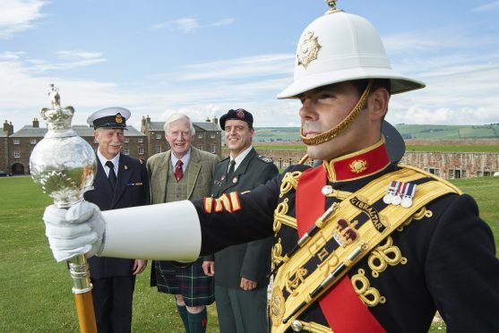 Left to right: Kurt Callebert and Patrick de Smet of the Royal Band of the Belgian Navy with Tattoo director Major General Seymour Monro (centre) and front Drum Major Tim Needham of The Band of HM Royal Marines Scotland at Fort George.
